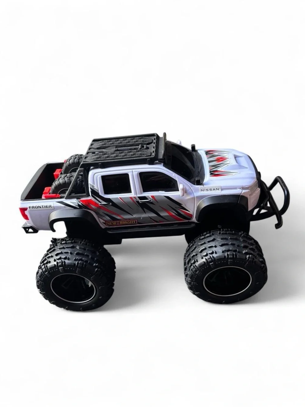 Nissan Frontier RC Truck with black & red lightning bolt graphics
